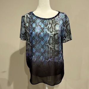 Lavender Brown, size Larger.  Sheer layer with a camisole underneath.